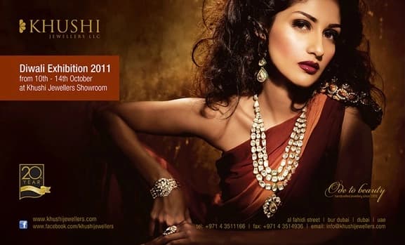 Landscape creative of a woman in a gold and polki necklace and a deep-orange drape, with an orange panel reading ‘Diwali Exhibition 2011, from 10th – 14th October at Khushi Jewellers Showroom’, a ‘20 years’ badge and the line ‘Ode to beauty’