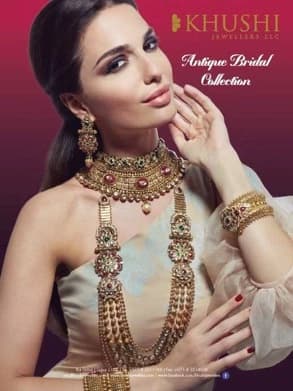 Print ad on a deep magenta ground: a woman in heavy antique gold bridal jewellery, the Khushi Jewellers logo and the words ‘Antique Bridal Collection’