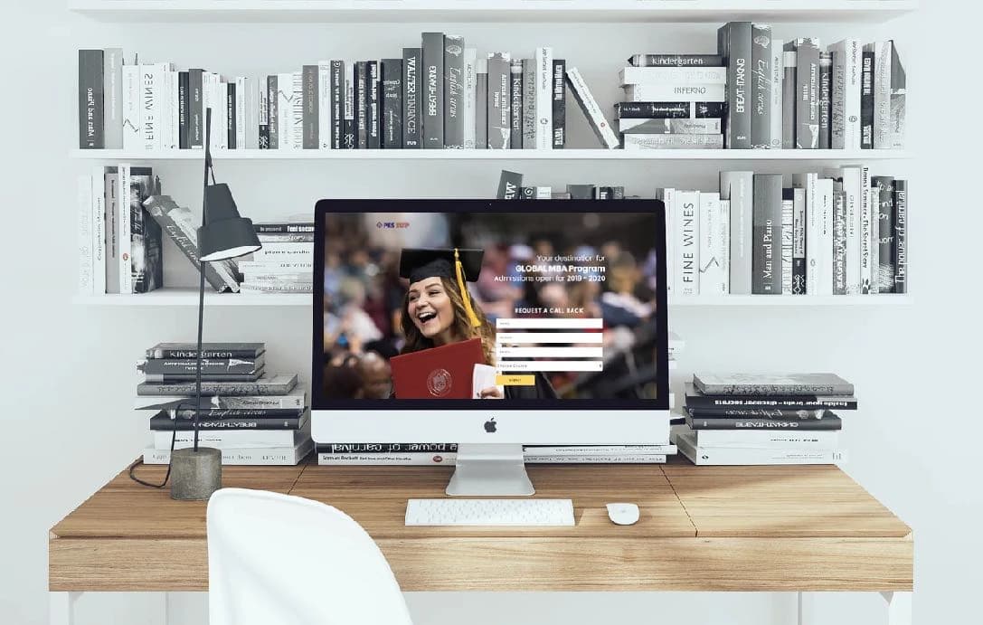 The PES IUP admissions landing page on a desktop: Global MBA programme, admissions open, enquiry form