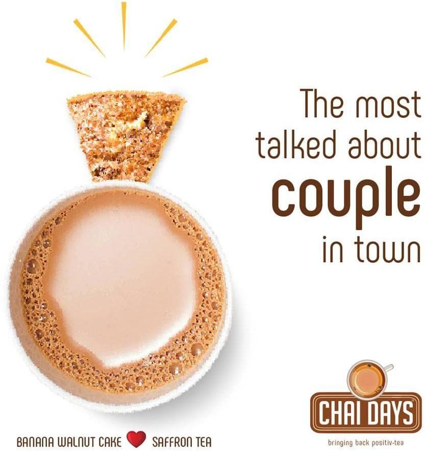 Cream creative: a cup of chai seen from above with a slice of cake set on its rim like a ring, captioned “The most talked about couple in town — Banana Walnut Cake, Saffron Tea”